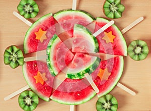 Still life, slices of watermelon, on a wooden stick. And carved kiwi.