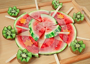 Still life, slices of watermelon, on a wooden stick. And carved kiwi.