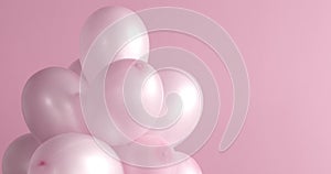 Still life of spining pink balloons.