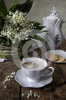 Still life with splendid bouquet wild flowers and coffee cup