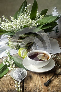 Still life with splendid bouquet wild flowers and tea cup