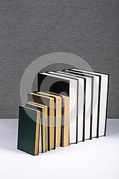 Still life with a stack of new and old books