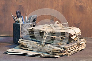 Still life with stack of old papers and books