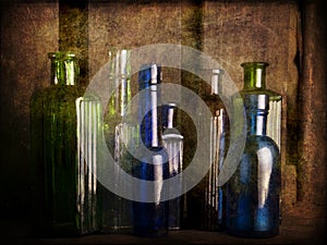 Still Life Study with old glass coloured bottles