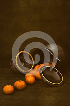 Still life with tangerines and kitchen utensils