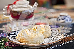 Still life of tea and cakes