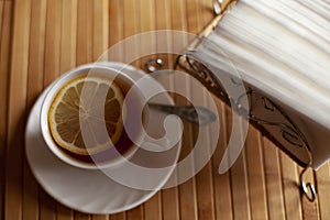 Still life, tea with lemon and napkins