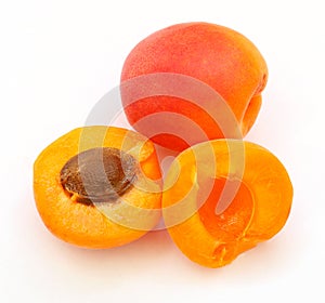 Still life of three apricots