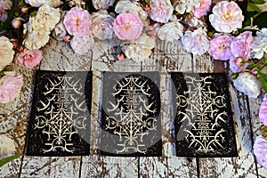 Still life with three tarot cards on witch table