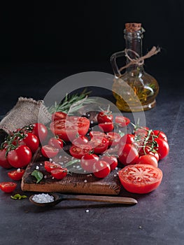 Still life with tomatoes of different sizes,