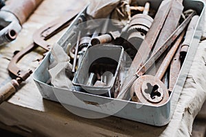still life tool box with nails rasp and old tools