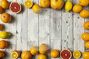 Still life top view of citrus fruits, grapefruit, Valencian oranges and lemons