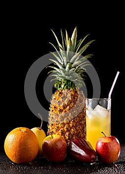 Still life tropical fruits and glass of juice