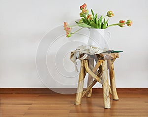 Still life with tulips bouquet on wooden rustic chair