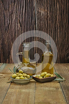 Still life with two glass containers filled with virgin olive oil