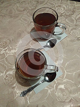 Still life-two glass glasses with black leaf tea