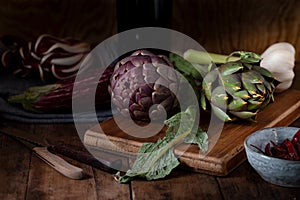 Still life with various Mediterranean vegetables on the cutting board