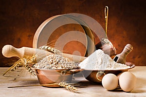 Still life. vintage kitchen utensils, flour and wheat