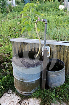 Still life with a water barrel