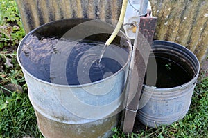 Still life with a water barrel