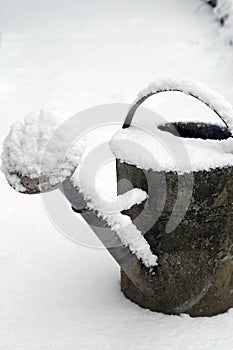 Still-life of a watering-can and snow