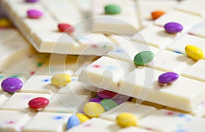 still life of white chocolate with smarties photo