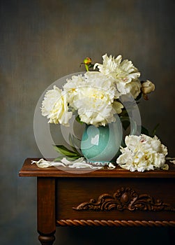 Still life with white peonies in a blue jug