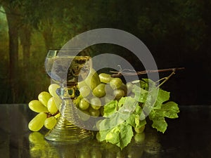 Still life with white wine glass and grapes