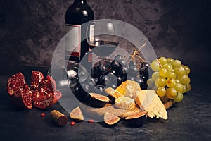 still life wine different cheeses and fruits