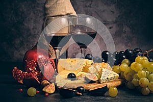 still life wine different cheeses and fruits