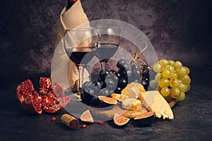 still life wine different cheeses and fruits