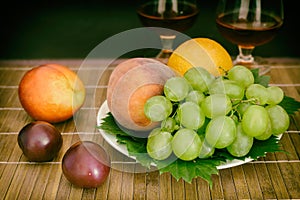 Still life: wine by the glass and fruit.