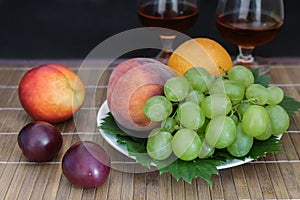 Still life: wine by the glass and fruit