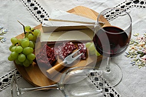 Still life with wine, soft cheese