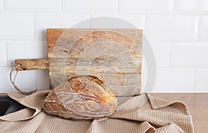Still life with a wooden kitchen board in the kitchen with pastries on a wooden board Kitchen. Wooden table background .