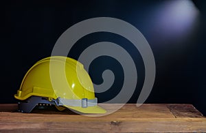Still life yellow helmet on table