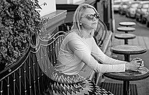 Still waiting him. Woman sits alone cafe terrace urban background defocused. Girl sit alone cafe waiting him. Woman