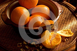 Stillife with oranges on rattan tray photo