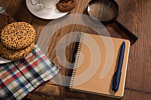 Stilllife with a notebook on the wooden table photo