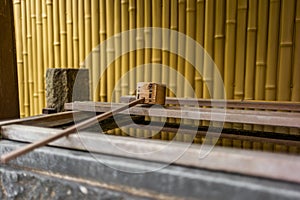 Stillness at the water basin at the entrance of a shrine in Japan for the riual Temizuya purification - 2