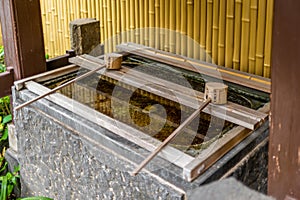 Stillness at the water basin at the entrance of a shrine in Japan for the riual Temizuya purification - 5