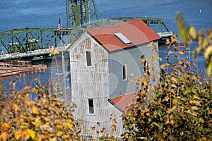 Stillwater, Minnesota in the fall - overlooking an old mill with fall leaves and the lift bridge on the St Croix River