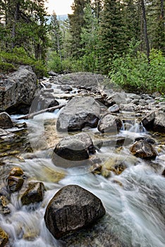 The Stillwater River rushes over rocks at the Woodbine Campground in the Custer Gallatin National Forest, Montana, USA