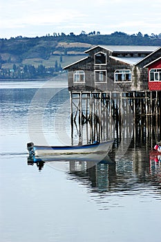 Stilt houses and boat in Chiloe Chile