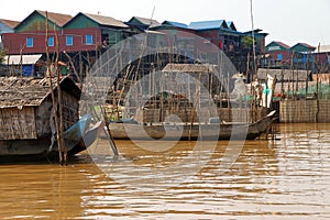 Stilt houses of Kompong Kleang floating village photo