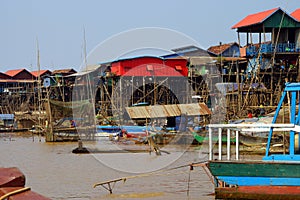 Stilt houses of Kompong Kleang floating village photo