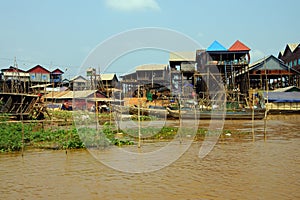 Stilt houses of Kompong Kleang floating village photo
