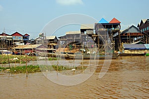 Stilt houses of Kompong Kleang floating village photo