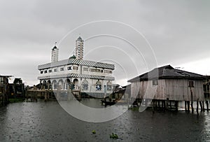 Stilt houses and mosque in the village of Ganvie on the Nokoue lake, Benin