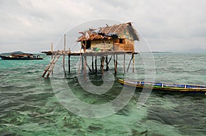 Stilted houses on the sea photo
